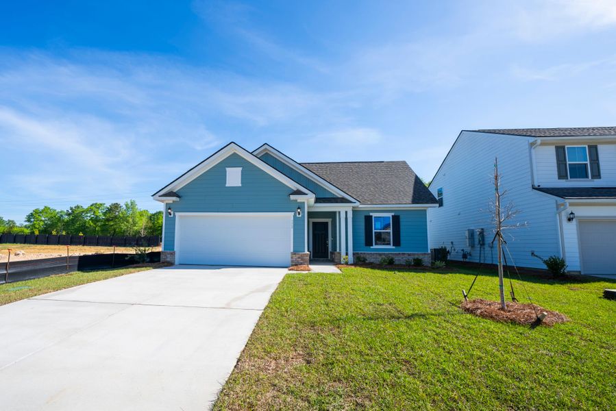 Front exterior of a new home in Monroe Preserve, Chapin, SC, highlighting curb appeal (Image 22). Front exterior of a new home in Monroe Preserve, Chapin, SC, highlighting curb appeal (Image 22).