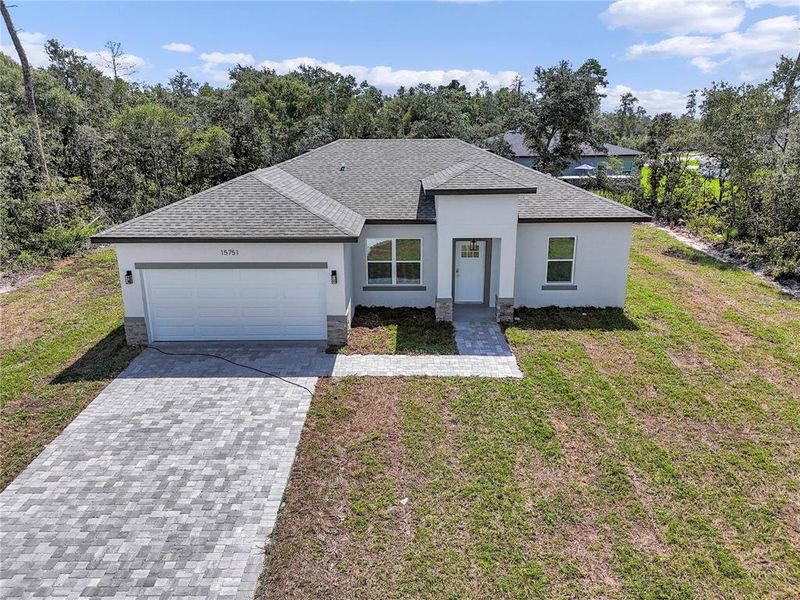 Front exterior of a new home in , Ocala, FL, highlighting curb appeal (Image 21).