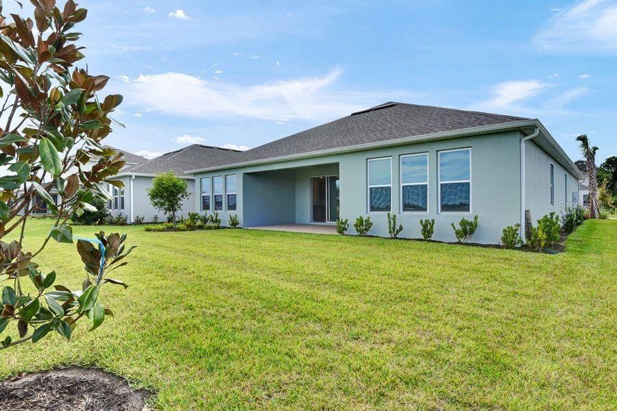 Front exterior of a new home in Ardisia Park, New Smyrna Beach, FL, highlighting curb appeal (Image 1).