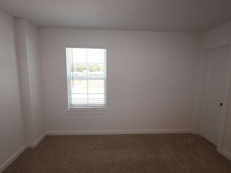 Spacious, unfurnished interior of a new home in Pinewood at Grand Texas, New Caney (Image 12).