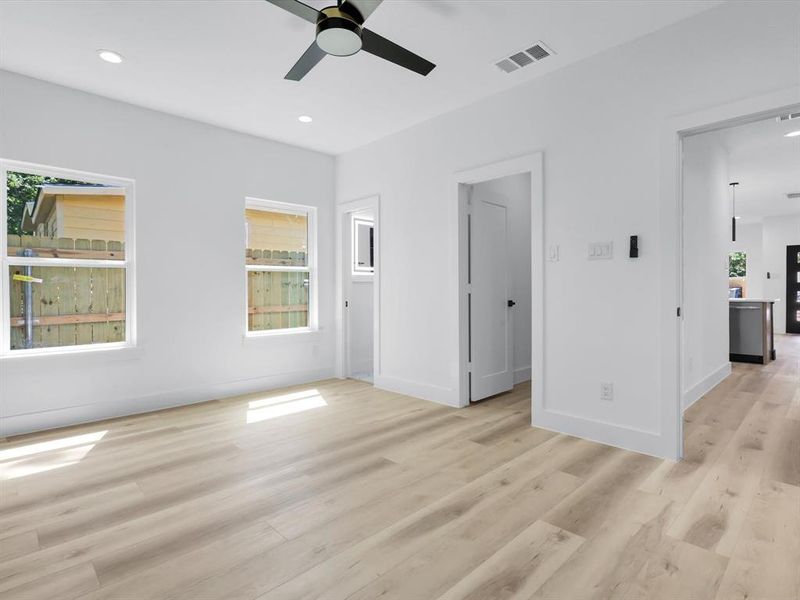 Spare room with light hardwood / wood-style flooring and ceiling fan