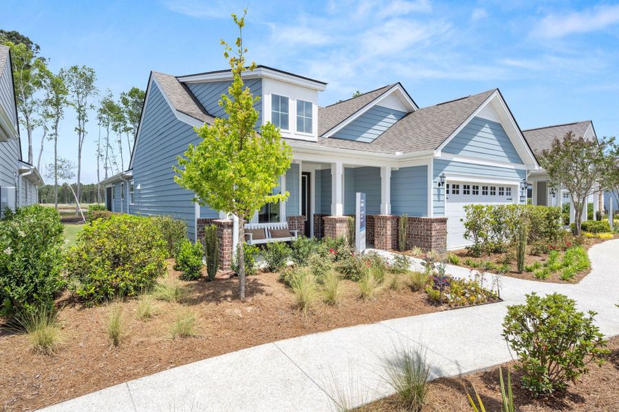 Front exterior of a new home in Waterways, Richmond Hill, GA, highlighting curb appeal (Image 2). Front exterior of a new home in Waterways, Richmond Hill, GA, highlighting curb appeal (Image 2).