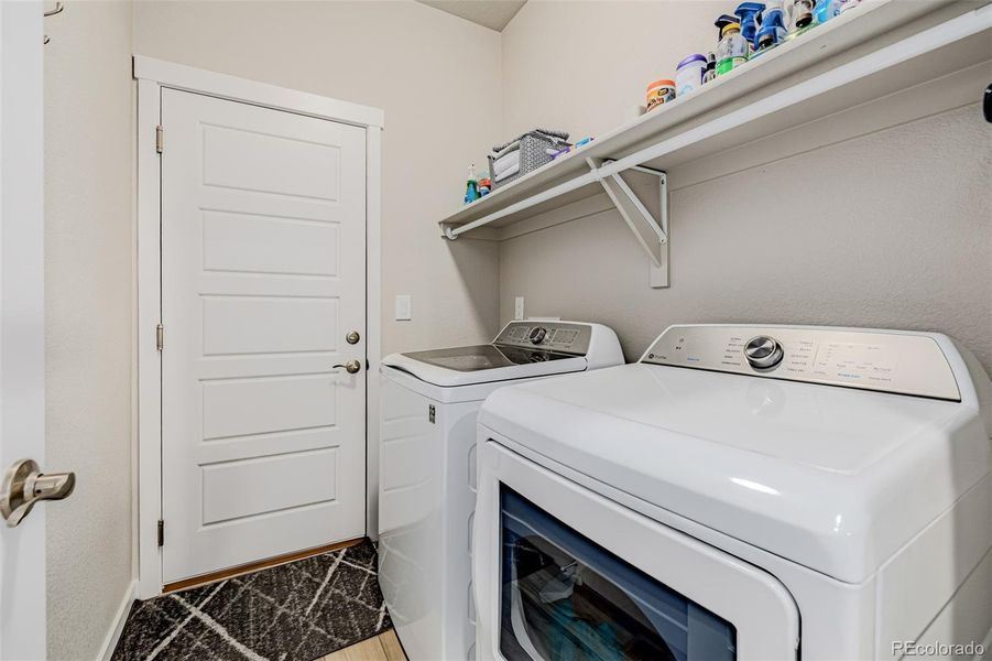 Laundry room with shelving Laundry room with shelving