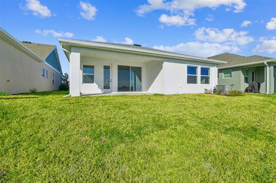 Exterior details and patio area of a home in The Peninsula at Rhodine Lake, Riverview (Image 3).