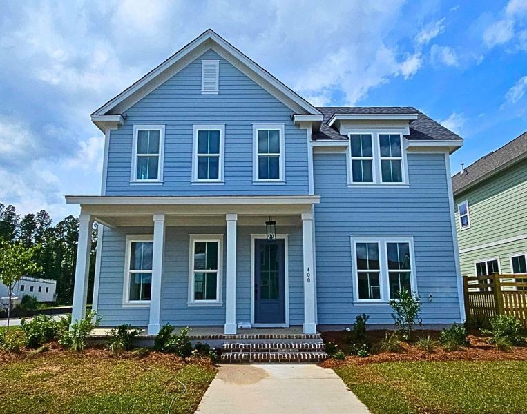 Front exterior of a new home in Nexton, Summerville, SC, highlighting curb appeal (Image 16). Front exterior of a new home in Nexton, Summerville, SC, highlighting curb appeal (Image 16).