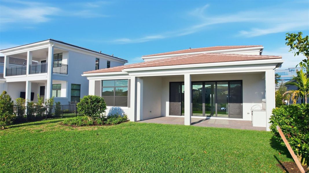Exterior details and patio area of a home in Artistry Palm Beach, Palm Beach Gardens (Image 2). Exterior details and patio area of a home in Artistry Palm Beach, Palm Beach Gardens (Image 2).