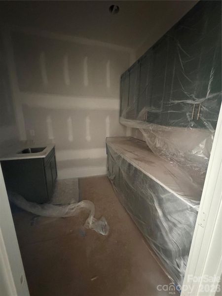 Full size laundry room off garage entry.