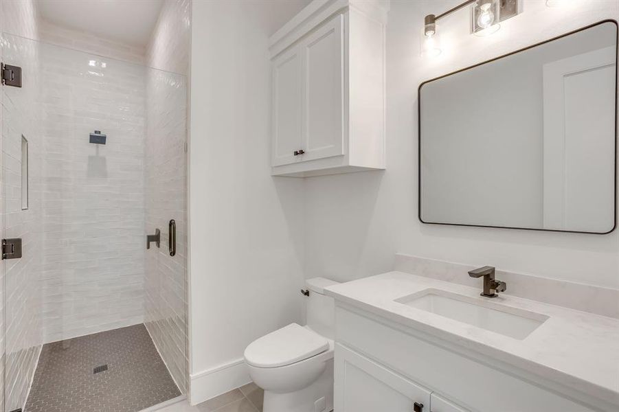 Bathroom featuring vanity and a stall shower