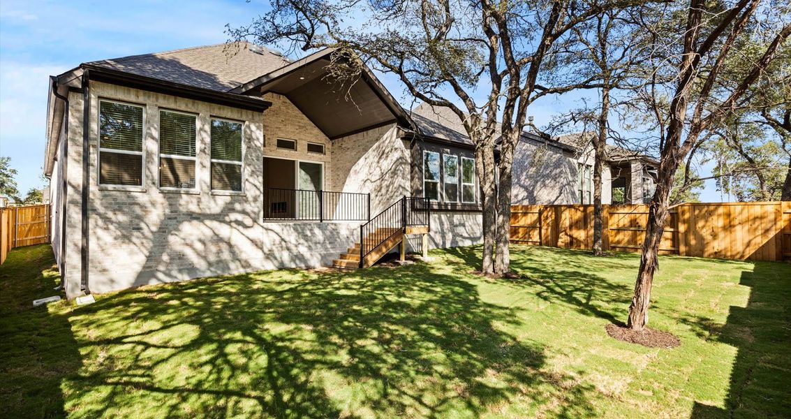 Front exterior of a new home in 6 Creeks, Kyle, TX, highlighting curb appeal (Image 2). Front exterior of a new home in 6 Creeks, Kyle, TX, highlighting curb appeal (Image 2).