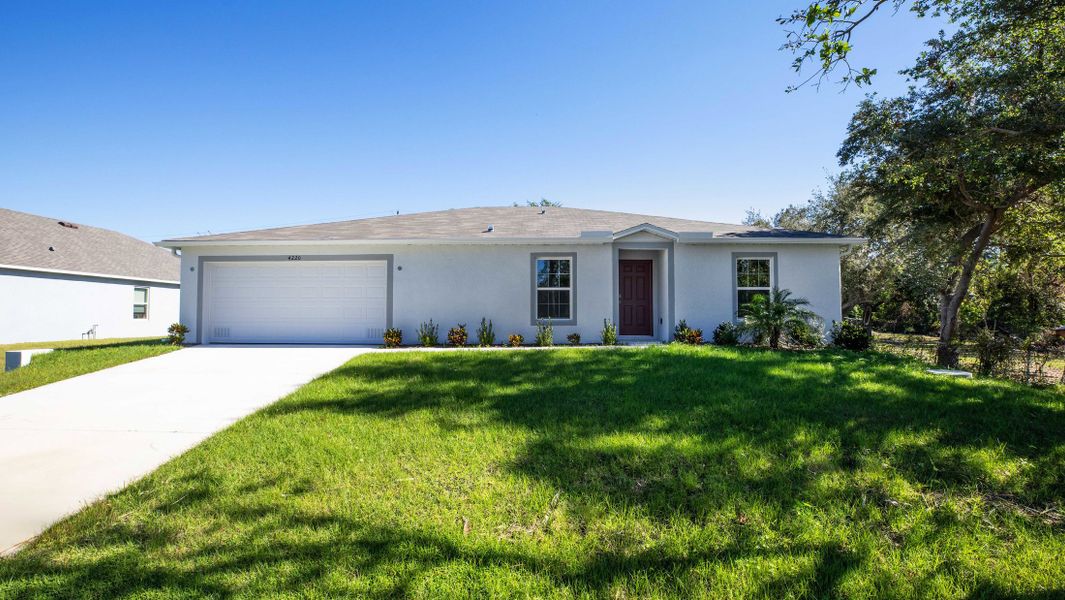 Representative exterior photo of a completed home built from the Iris by Maronda Homes in Coastal Communities, Edgewater, FL (Image 25).