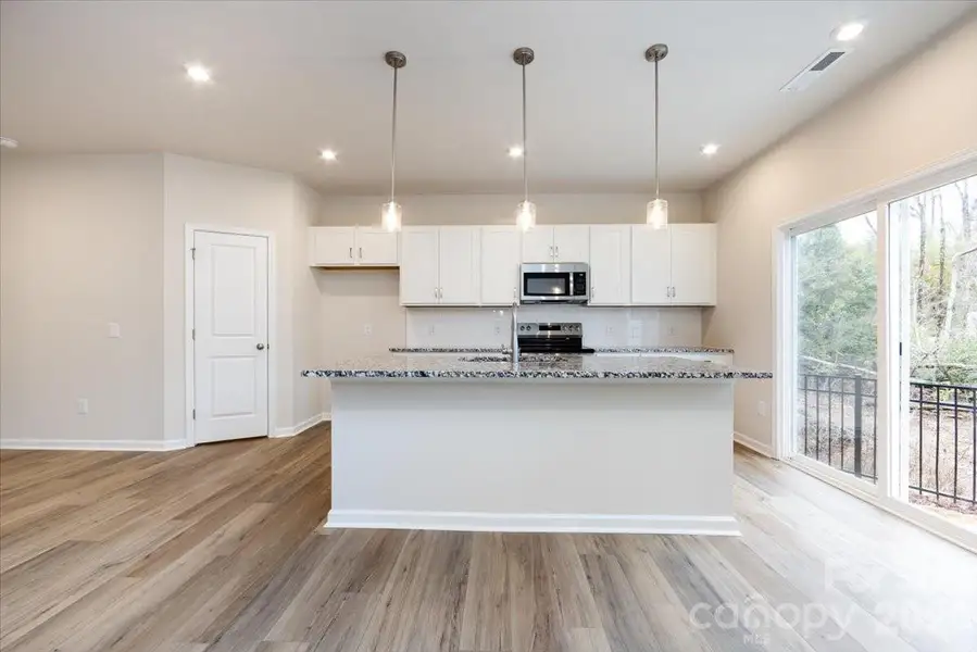 Chef-inspired kitchen with white cabinets