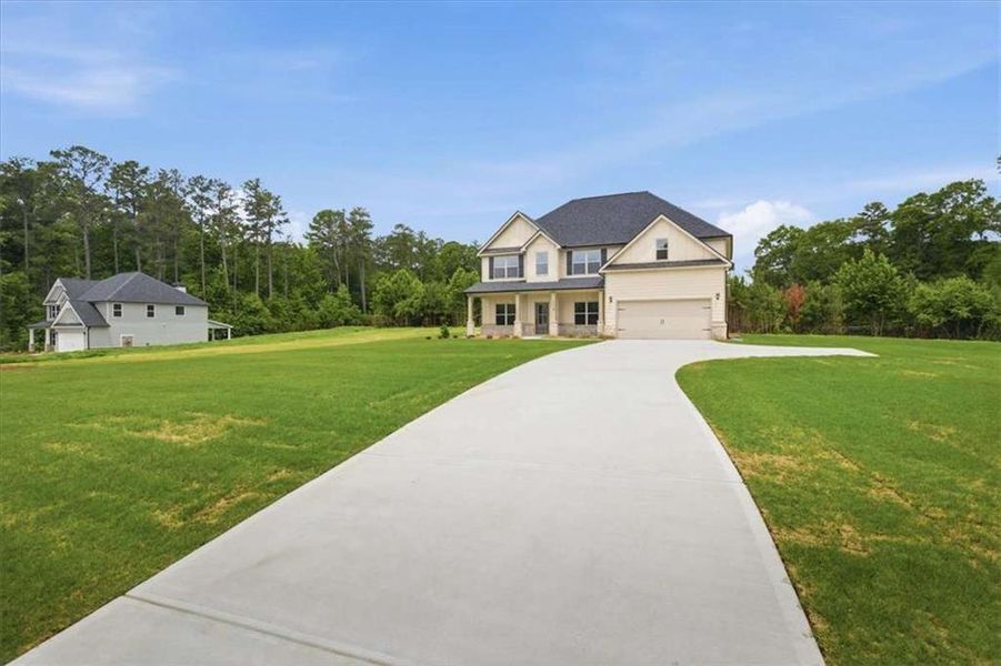Front exterior of a new home in , Stockbridge, GA, highlighting curb appeal (Image 21).