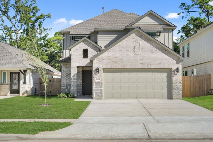 Front exterior of a new home in Cypresswood Landing, Humble, TX, highlighting curb appeal (Image 1).