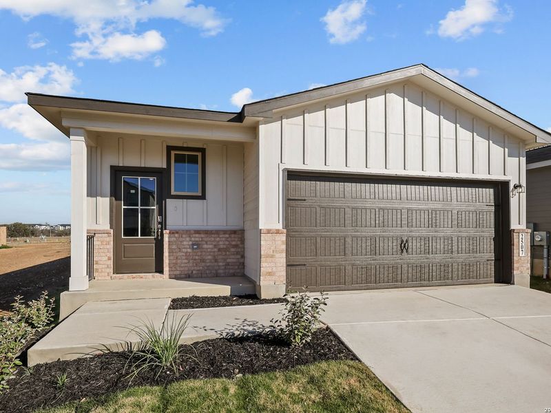Front exterior of a new home in Applewhite Meadows, San Antonio, TX, highlighting curb appeal (Image 20). Front exterior of a new home in Applewhite Meadows, San Antonio, TX, highlighting curb appeal (Image 20).