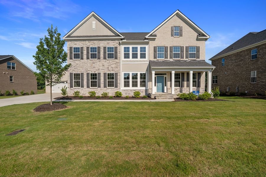 Front exterior of a new home in Walnut Grove, Easley, SC, highlighting curb appeal (Image 1). Front exterior of a new home in Walnut Grove, Easley, SC, highlighting curb appeal (Image 1).