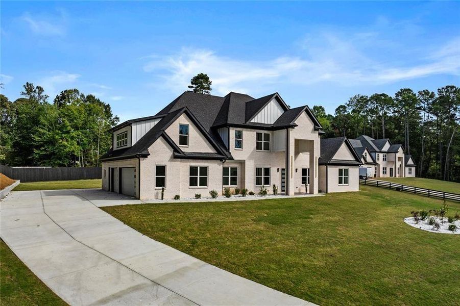 Front exterior of a new home in , Loganville, GA, highlighting curb appeal (Image 26).