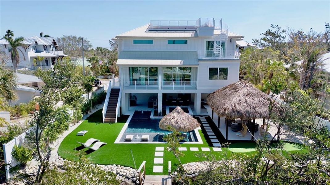 Front exterior of a new home in , Anna Maria, FL, highlighting curb appeal (Image 24).