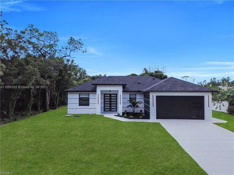 Front exterior of a new home in , Lehigh Acres, FL, highlighting curb appeal (Image 2). Front exterior of a new home in , Lehigh Acres, FL, highlighting curb appeal (Image 2).