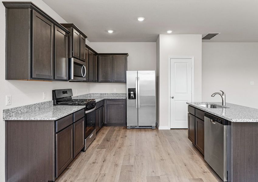 The spacious kitchen makes cooking meals easier than ever. The spacious kitchen makes cooking meals easier than ever.