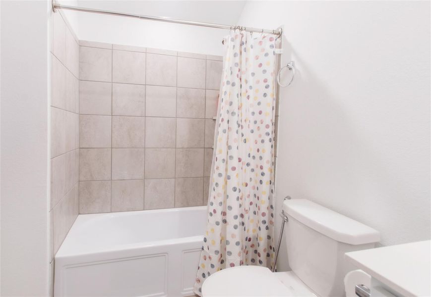 Third Bathroom featuring vanity and shower/tub combo