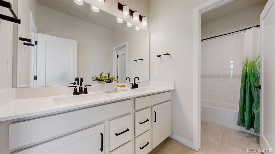 Full upper level bathroom with double sinks