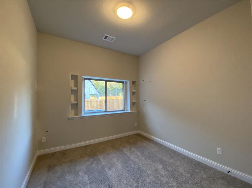 Bed 3 with vaulted ceiling & built-in shelves