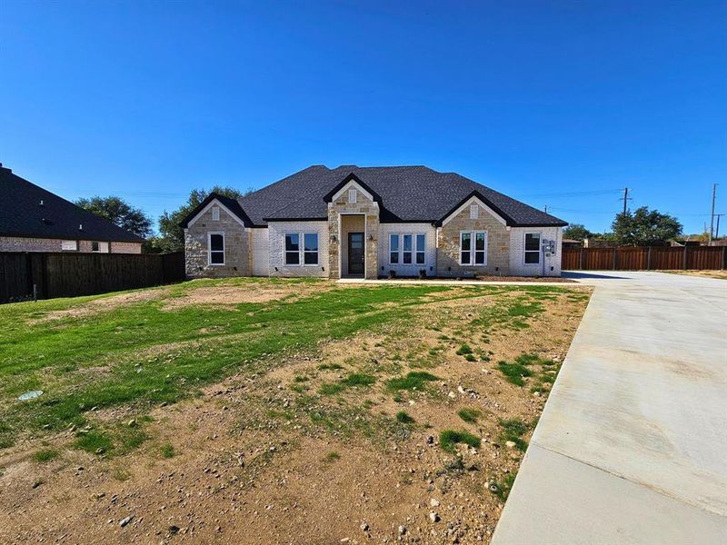 Front exterior of a new home in , Weatherford, TX, highlighting curb appeal (Image 23).