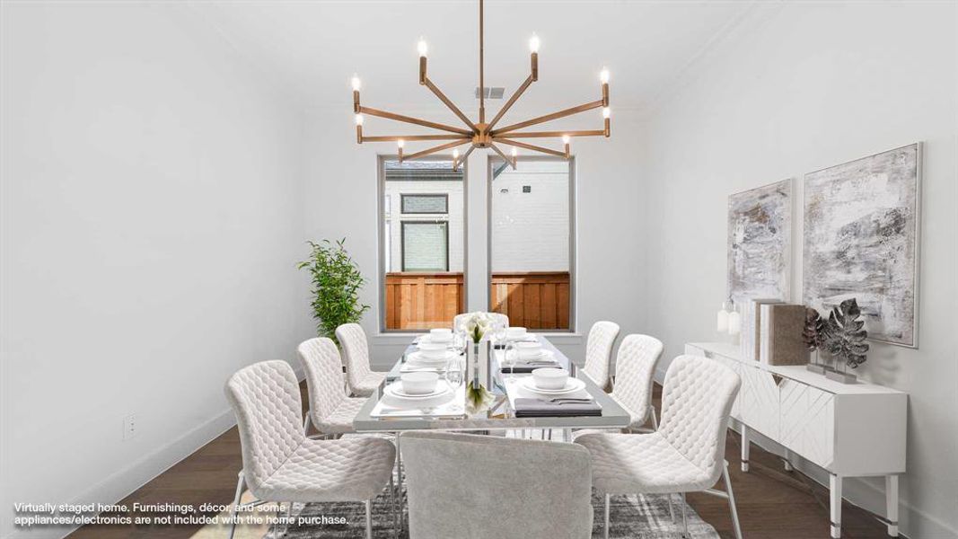 Dining space with a notable chandelier and dark hardwood / wood-style flooring