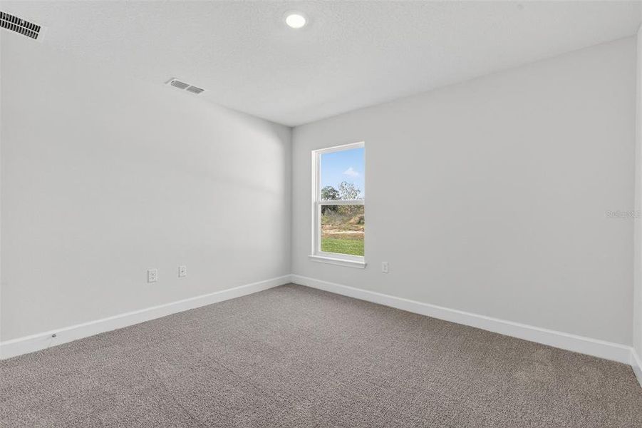 Spacious, unfurnished interior of a new home in Hill Country Estates, Dade City (Image 32).