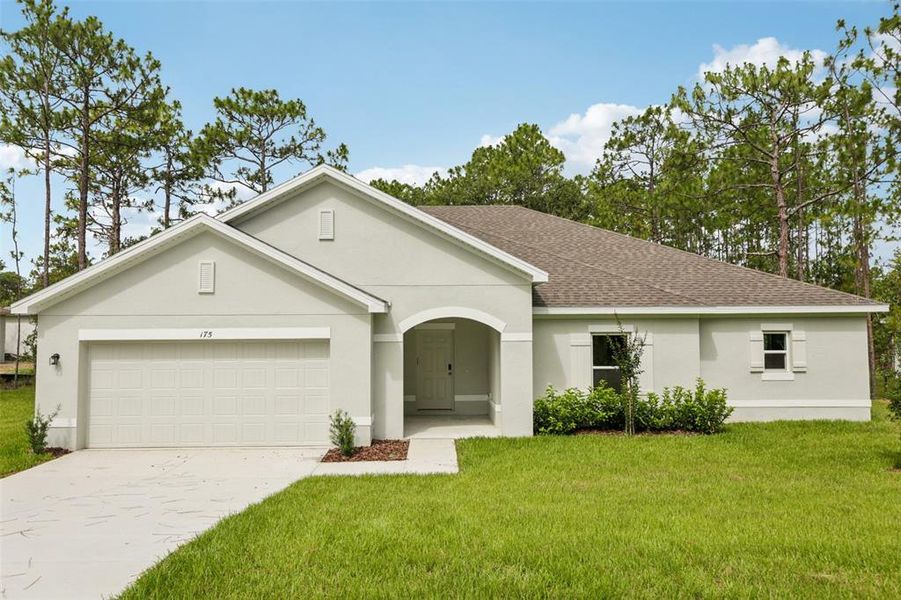 Front exterior of a new home in Sugarmill Woods, Homosassa, FL, highlighting curb appeal (Image 2).