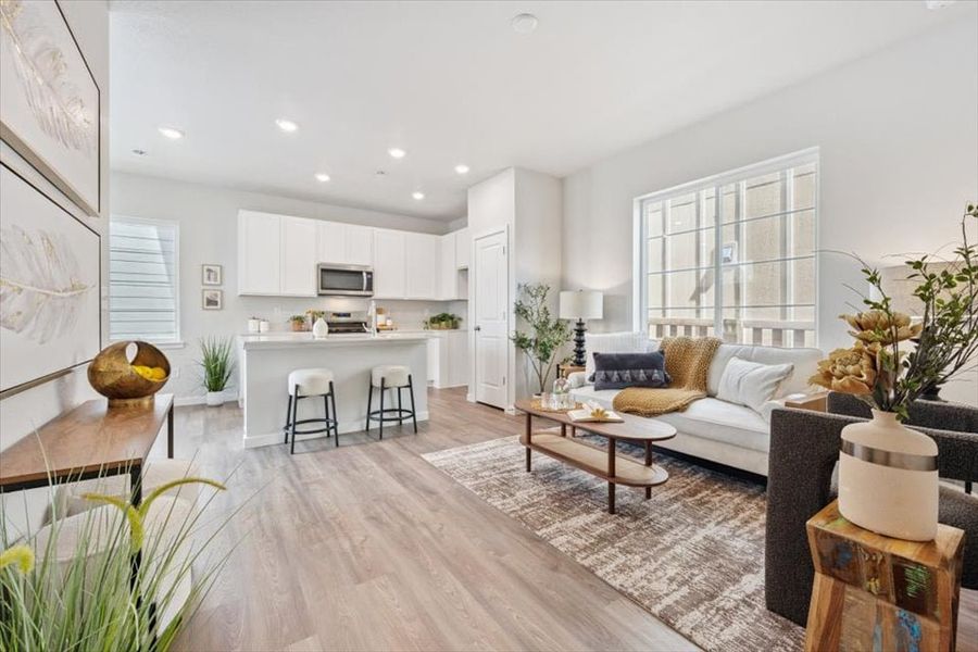 A living room with a wood floor. A living room with a wood floor.
