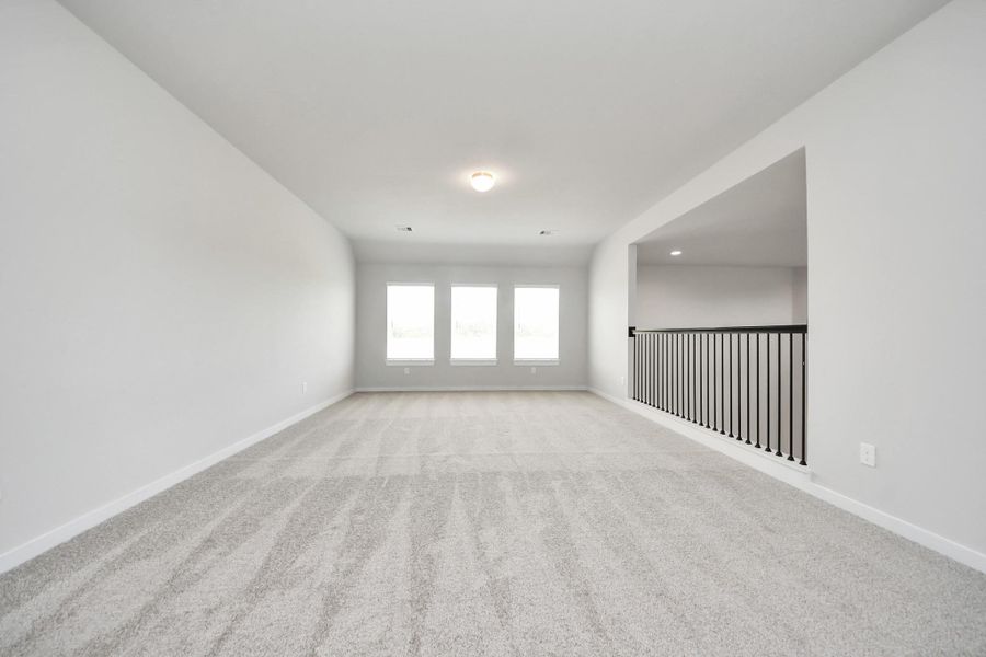 Generously sized secondary bedrooms featuring spacious closets, soft and inviting carpeting underfoot, large windows allowing plenty of natural light, and the added touch of privacy blinds for your personal retreat. Sample photo of completed home with similar floor plan. Actual colors and selections may vary. Generously sized secondary bedrooms featuring spacious closets, soft and inviting carpeting underfoot, large windows allowing plenty of natural light, and the added touch of privacy blinds for your personal retreat. Sample photo of completed home with similar floor plan. Actual colors and selections may vary.