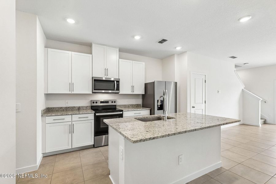 Furnished interior view inside a new home in The District at Oakleaf - The Commons, Middleburg (Image 5).