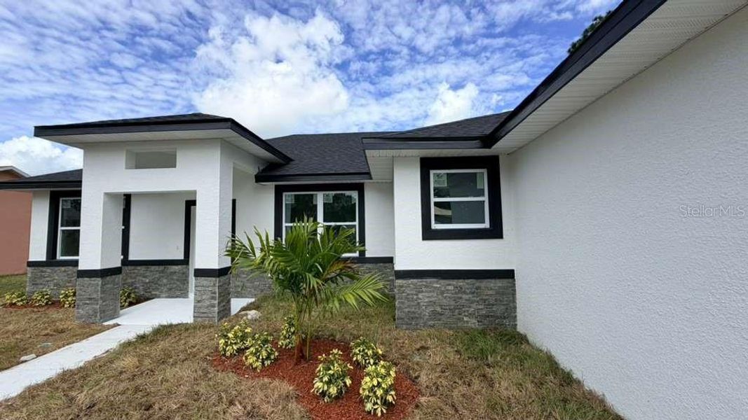 Exterior details and patio area of a home in , North Port (Image 13).