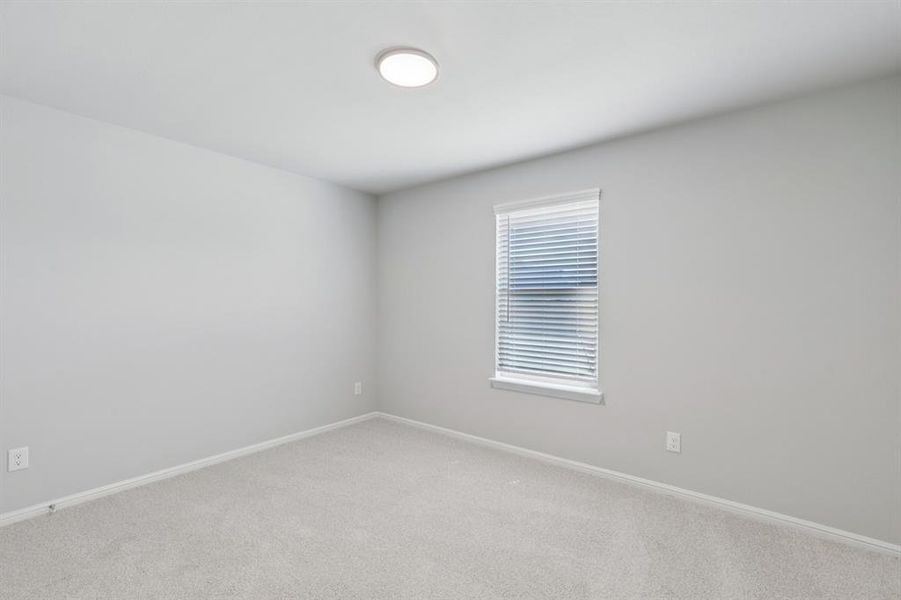 Bedroom in the Harrison home plan by Trophy Signature Homes – REPRESENTATIVE PHOTO Bedroom in the Harrison home plan by Trophy Signature Homes – REPRESENTATIVE PHOTO