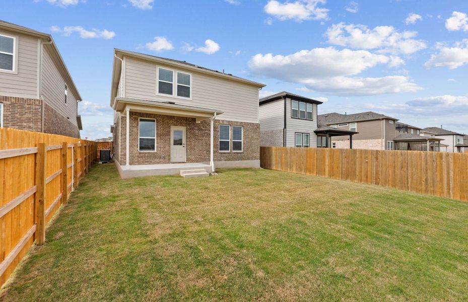 Exterior details and patio area of a home in Crosswinds, Kyle (Image 8).