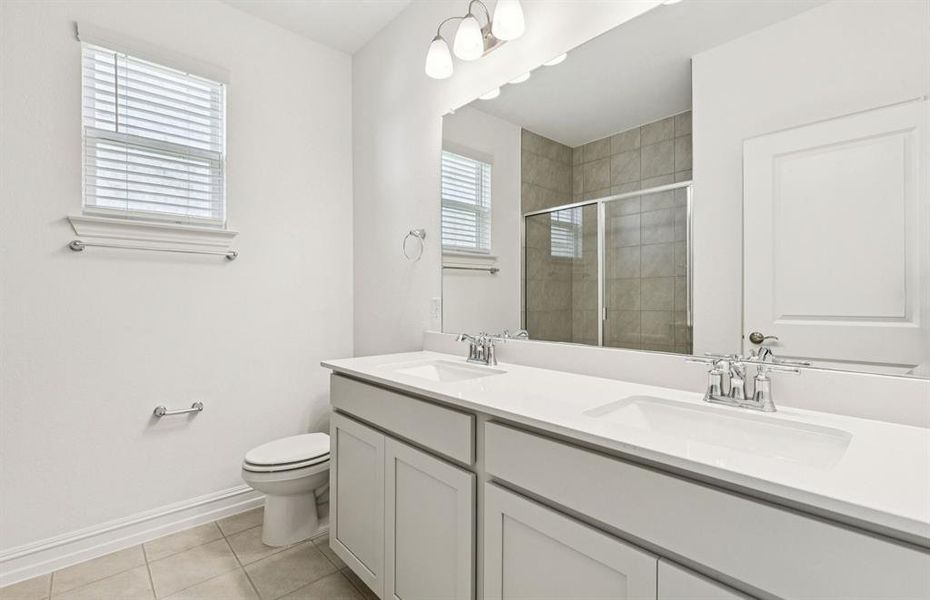 Spacious secondary bathroom with double sinks Spacious secondary bathroom with double sinks