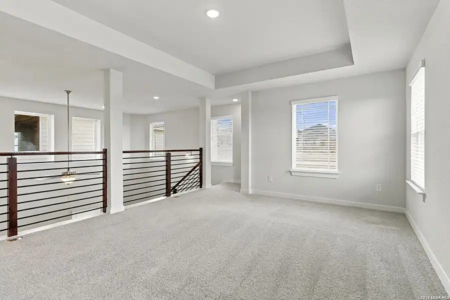 Spacious, unfurnished interior of a new home in Hunters Ranch, San Antonio (Image 20).