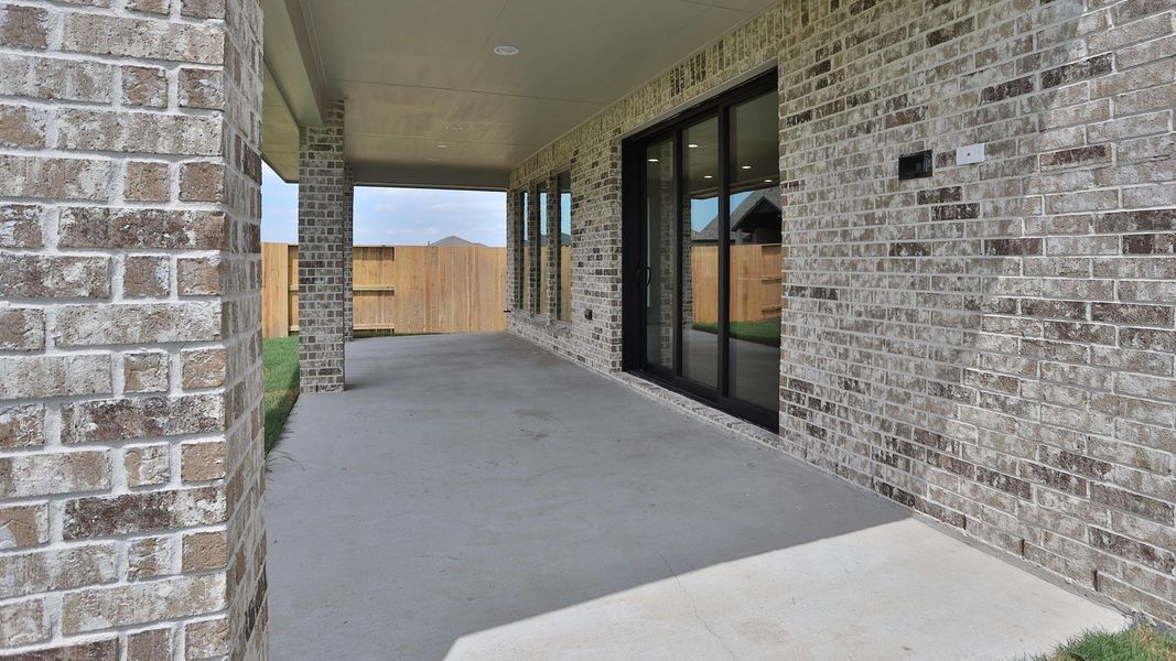 Exterior details and patio area of a home in Meridiana, Manvel (Image 3).