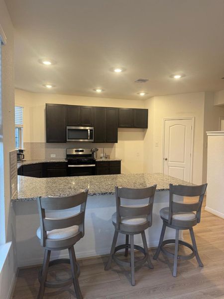 Furnished interior view inside a new home in Sunterra, Katy (Image 11).