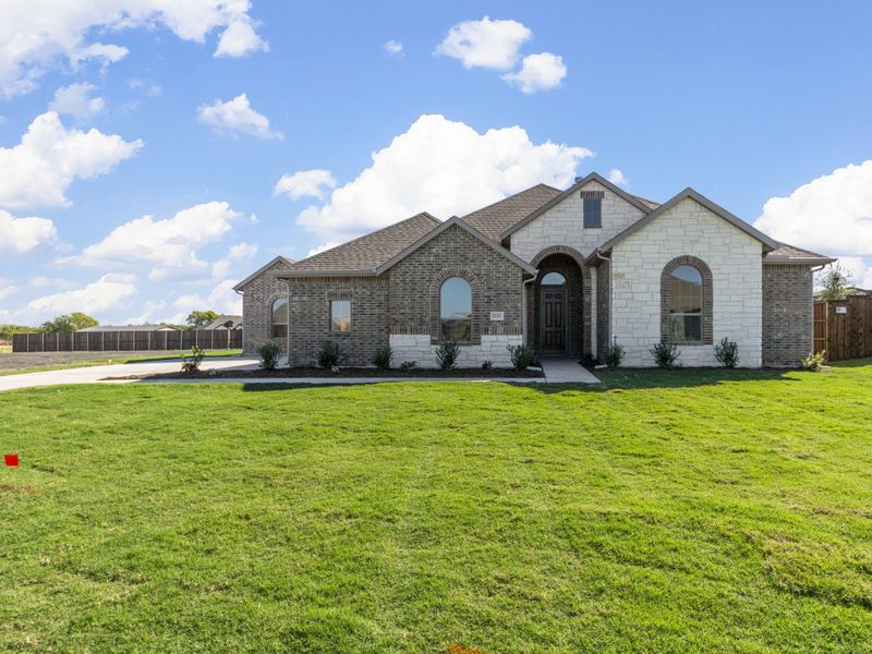Representative exterior photo of a completed home built from the Eliot II by Robbie Hale Homes in High Meadows Estates, Nevada, TX (Image 26). Representative exterior photo of a completed home built from the Eliot II by Robbie Hale Homes in High Meadows Estates, Nevada, TX (Image 26).