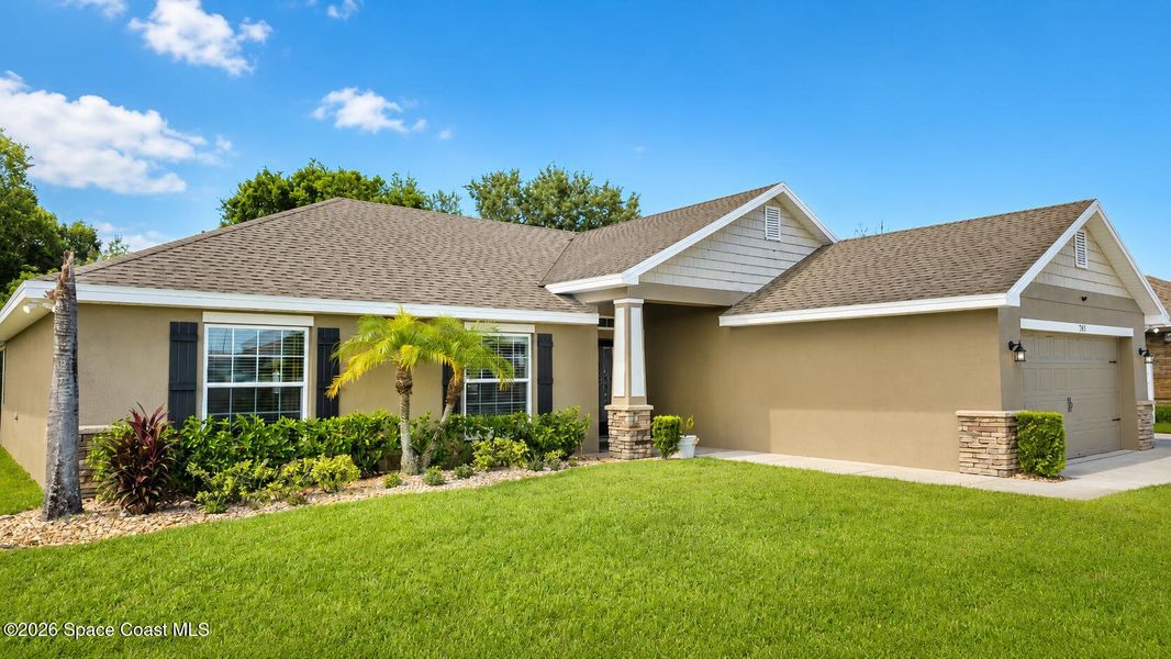 Front exterior of a new home in Palm Bay, Palm Bay, FL, highlighting curb appeal (Image 1). Front exterior of a new home in Palm Bay, Palm Bay, FL, highlighting curb appeal (Image 1).