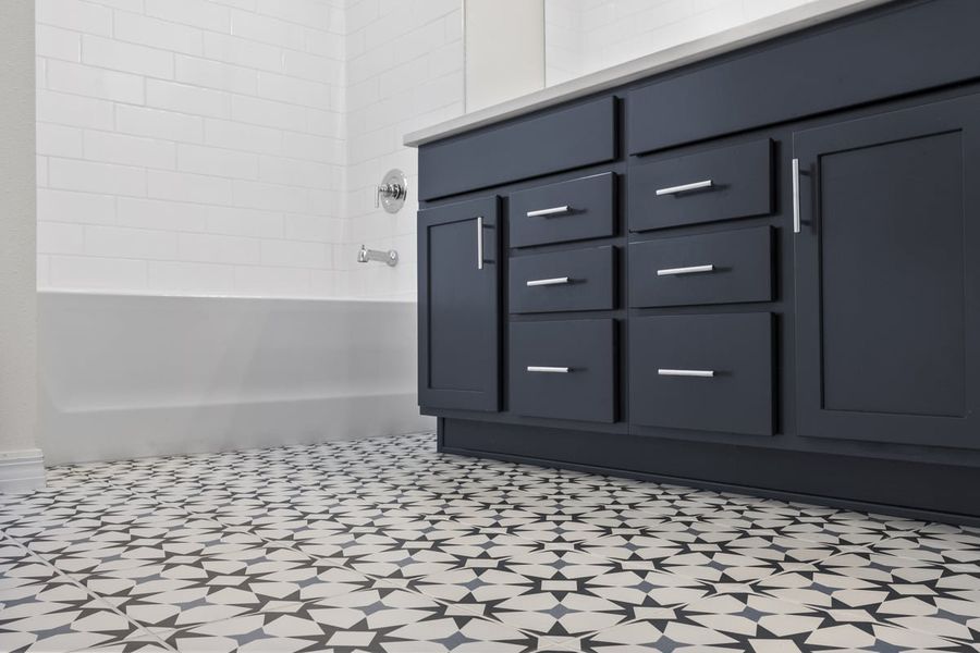 Ceramic tile flooring at primary bath