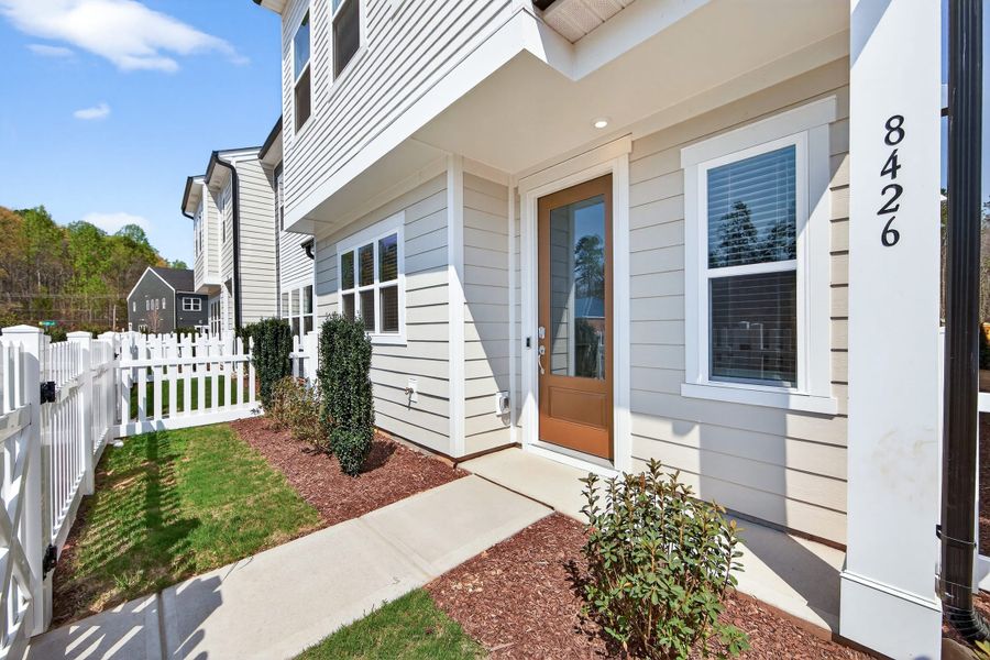 Exterior details and patio area of a home in Ellis Townes, Charlotte (Image 4). Exterior details and patio area of a home in Ellis Townes, Charlotte (Image 4).