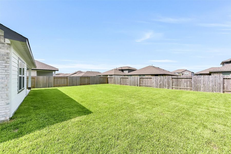 Front exterior of a new home in River Ranch Meadows, Dayton, TX, highlighting curb appeal (Image 21).
