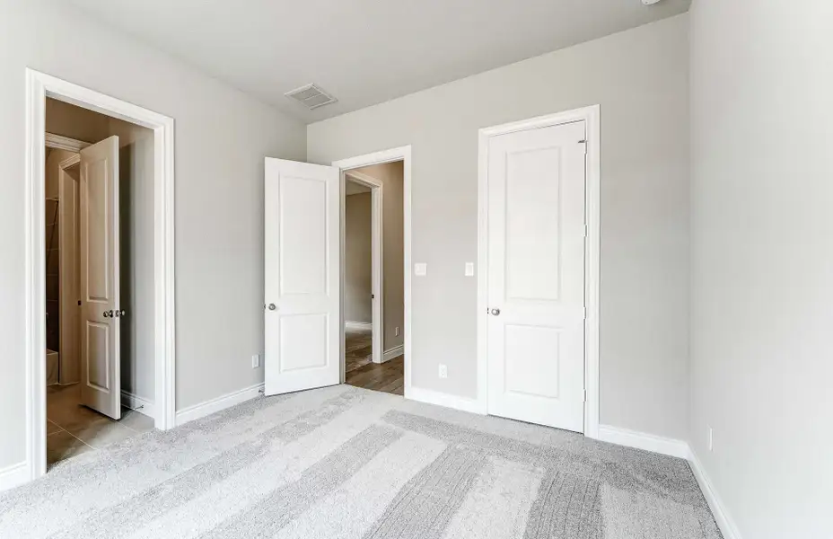 Representative unfurnished interior of a home built from the 2909 by Ravenna Homes in The Woodlands Hills 65′, Willis (Image 35). Representative unfurnished interior of a home built from the 2909 by Ravenna Homes in The Woodlands Hills 65′, Willis (Image 35).