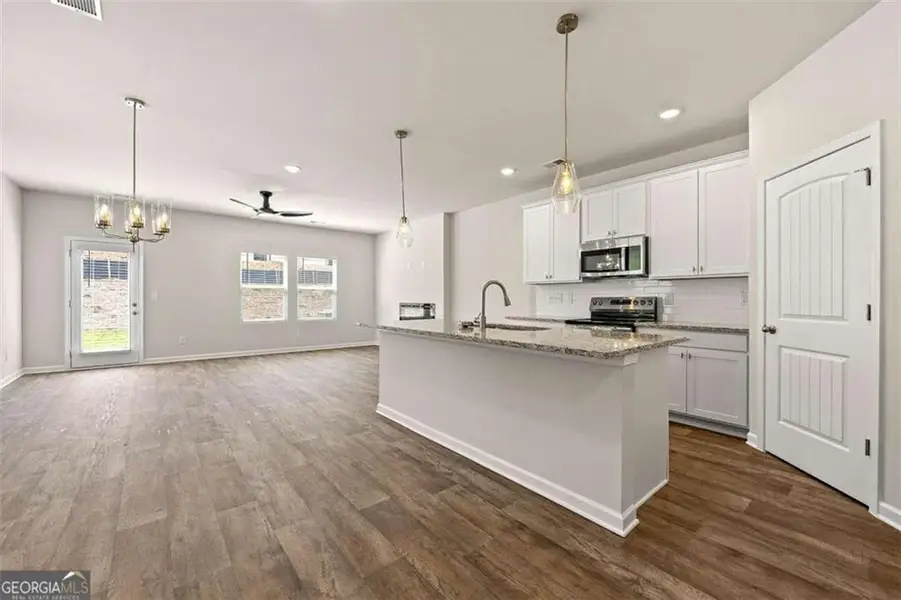Furnished interior view inside a new home in The Grove At Mundy Mill, Gainesville (Image 9).