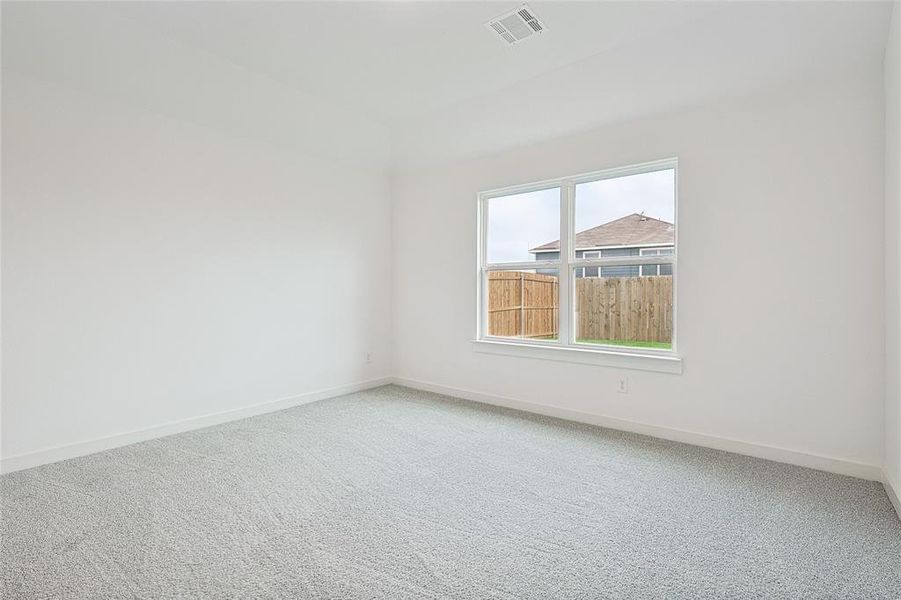 Empty room featuring carpet flooring