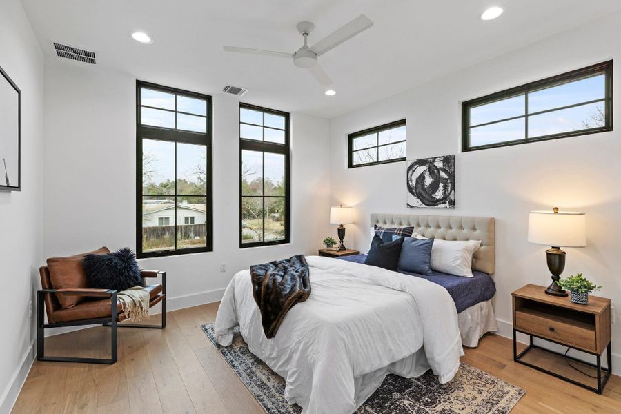 Bedroom featuring recessed lighting, light wood finished floors, baseboards, and ceiling fan
