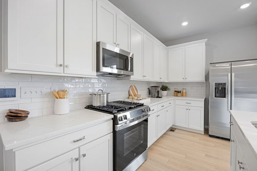 Representative furnished interior of a home built from the 2504 by Risewell Homes in Harvest Crossing, Aurora (Image 9).